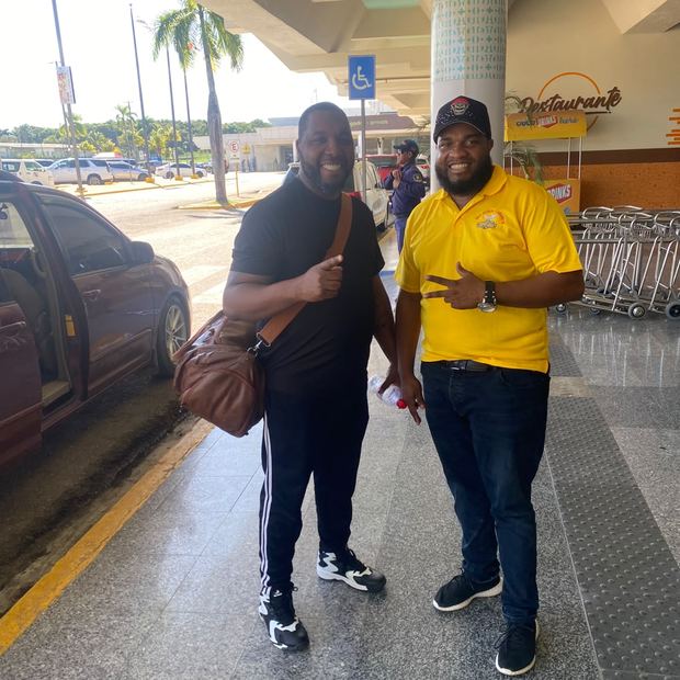 Roque Luis with a passenger at the airport terminal